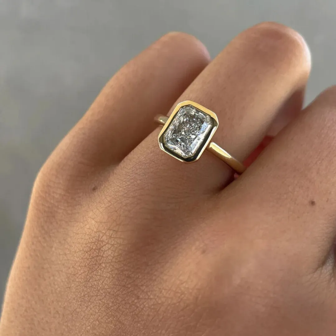 /public/photos/live/Ice Crushed Radiant Cut Bezel Set Moissanite Ring 631 (2).webp